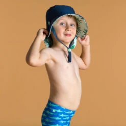 Chapeau Anti UV Bébé Réversible Bleu Et Imprimé Palmiers -Meilleur Surf Magasin chapeau anti uv bebe reversible bleu et imprime palmiers 2